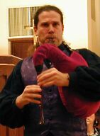 Photograph of Tom Zajac playing bagpipe